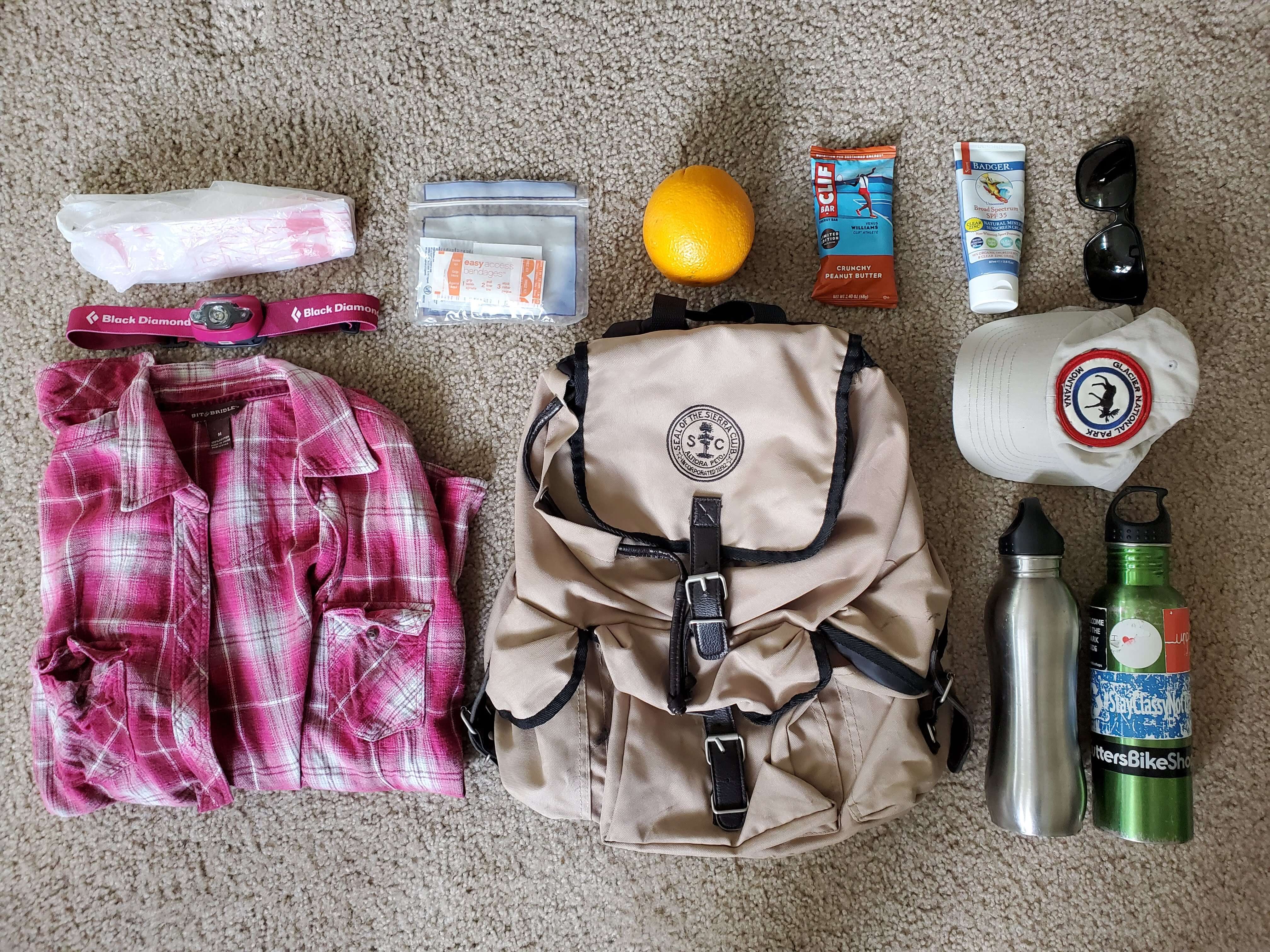 Hiking gear laid out on a floor