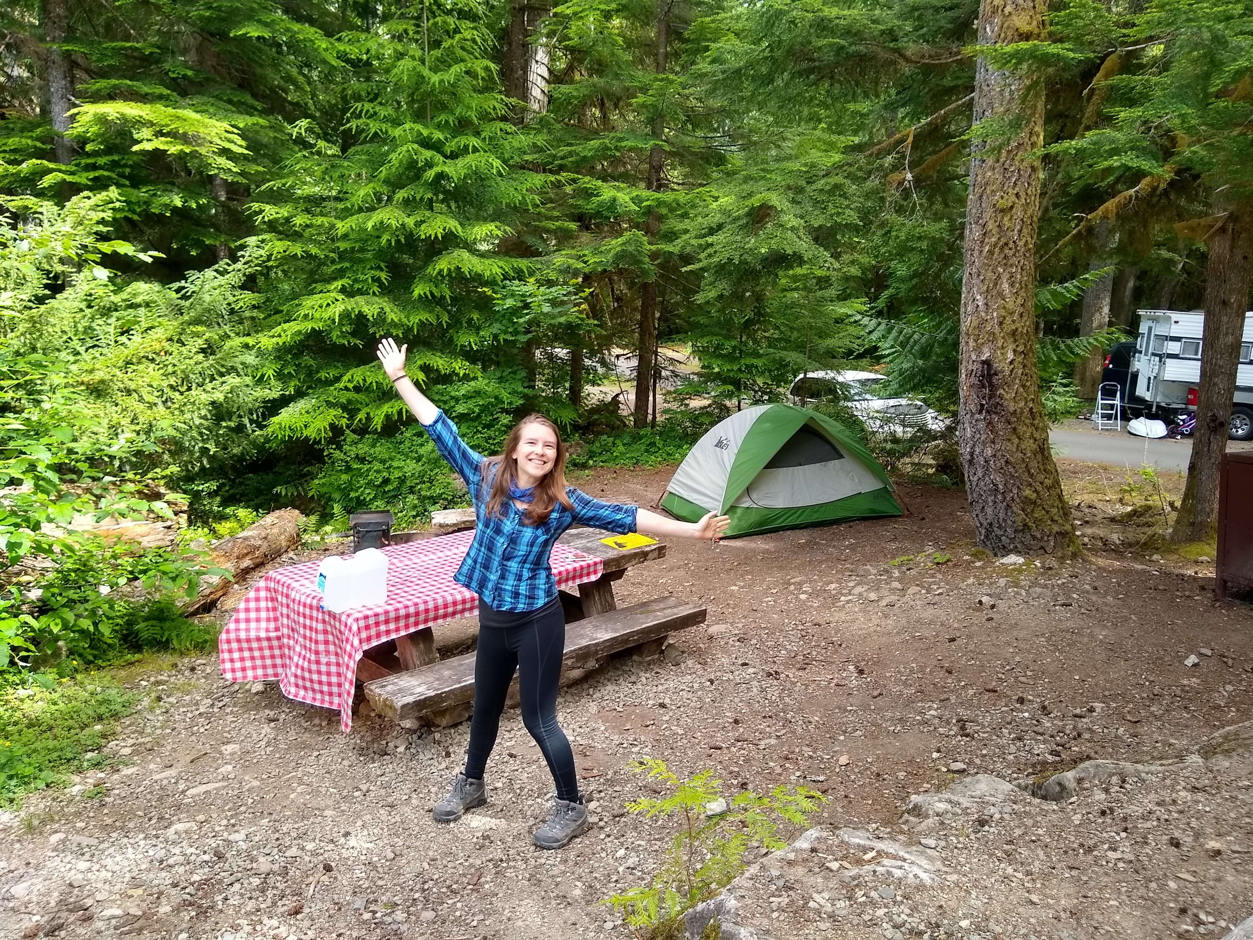 Camper smiling at a campsite in Colonial Creek North campground in North Cascades National Park