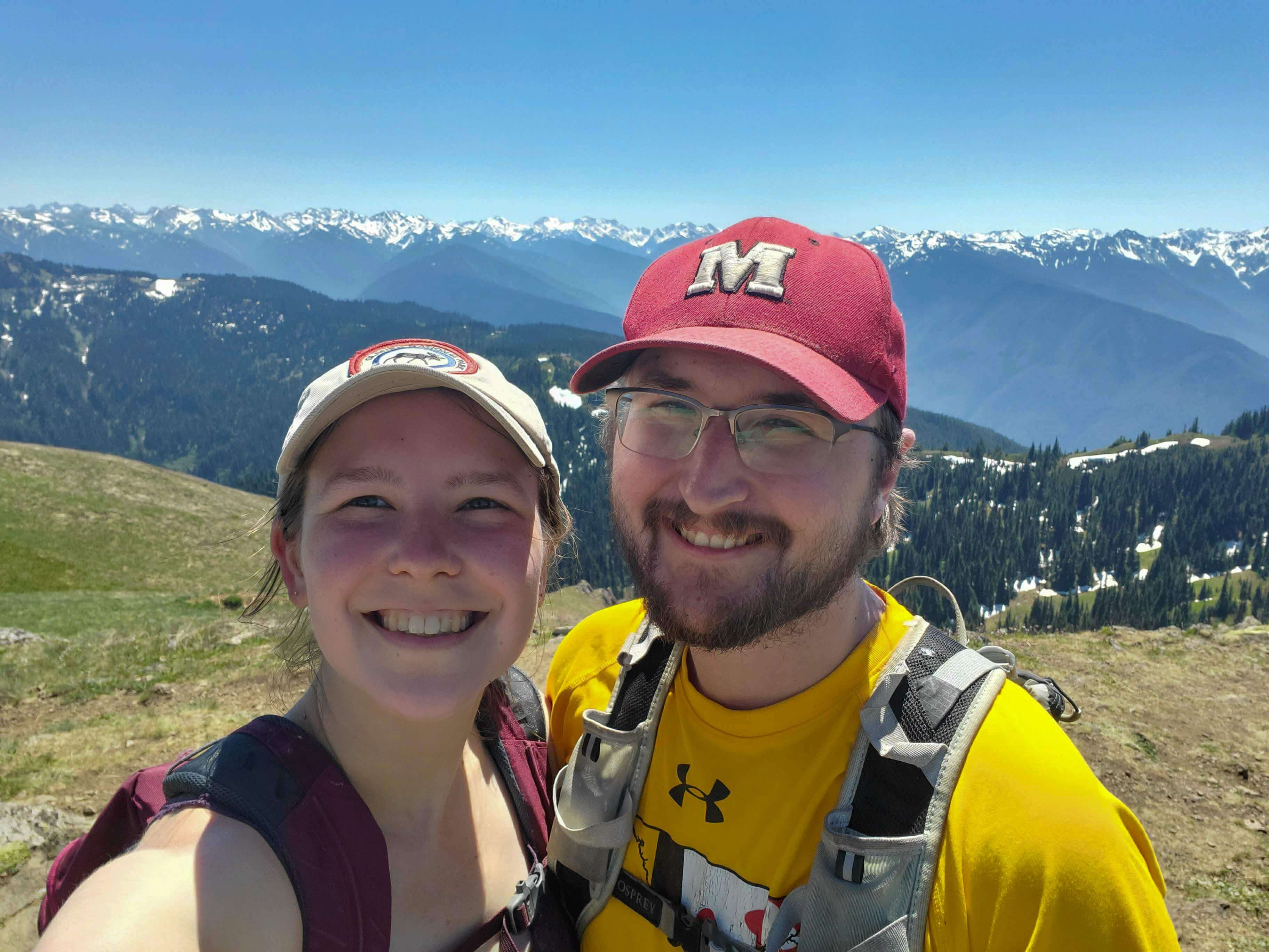 Hikers smiling at the top of the Hurricane Hill trail in Olympic National Park