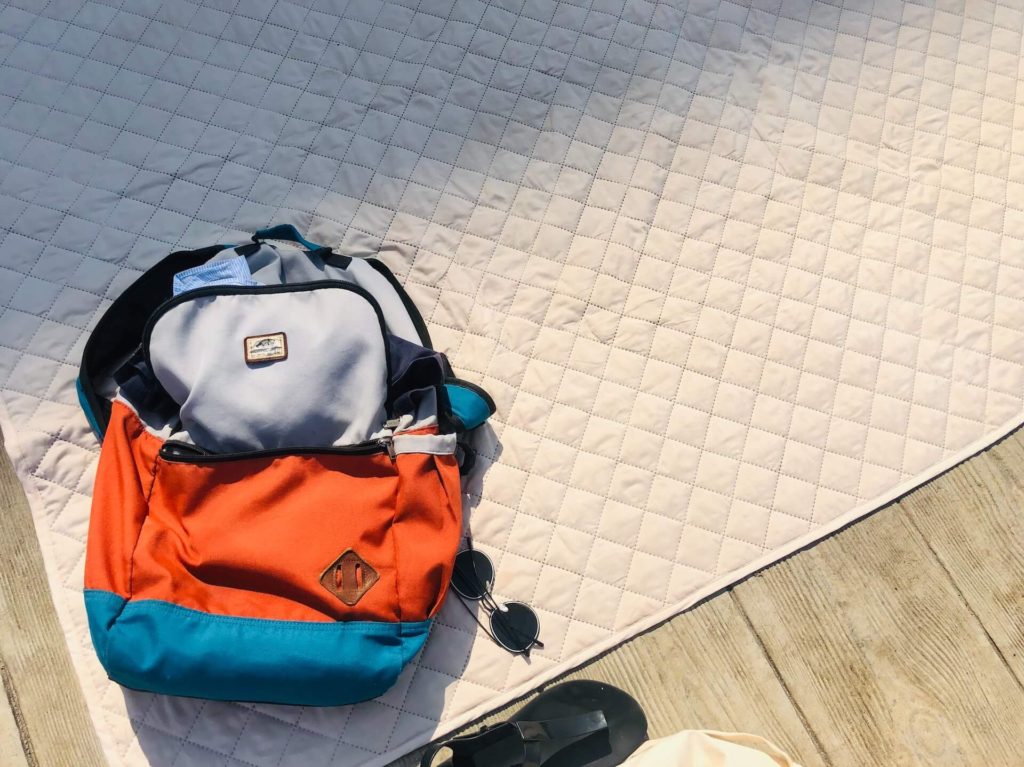 A backpack on a rug