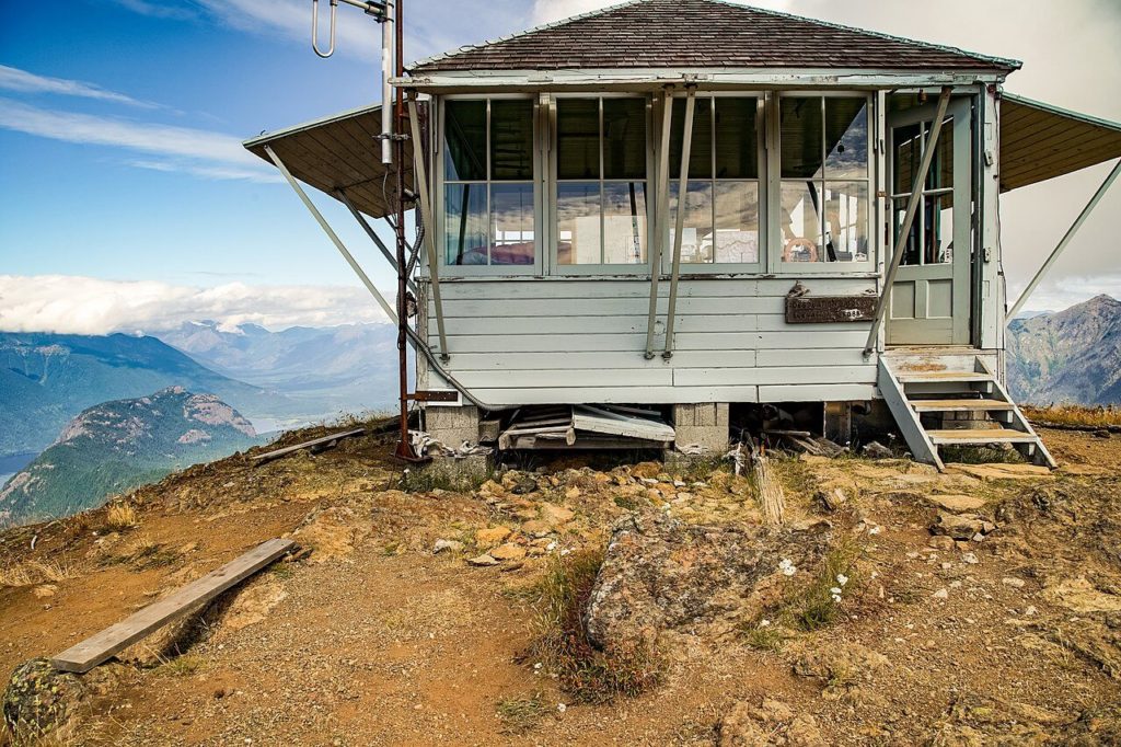 A close up view of the short fire lookout on Desolation Peak in Washington